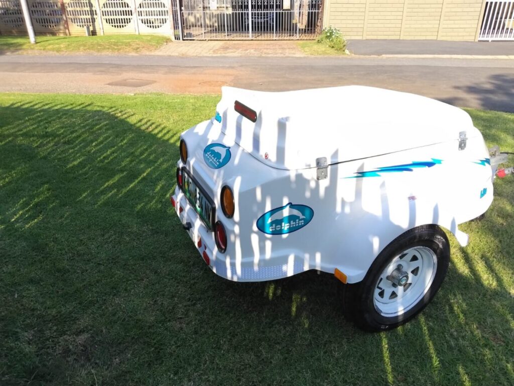 Rear side view of white Dolphin Lite trailer