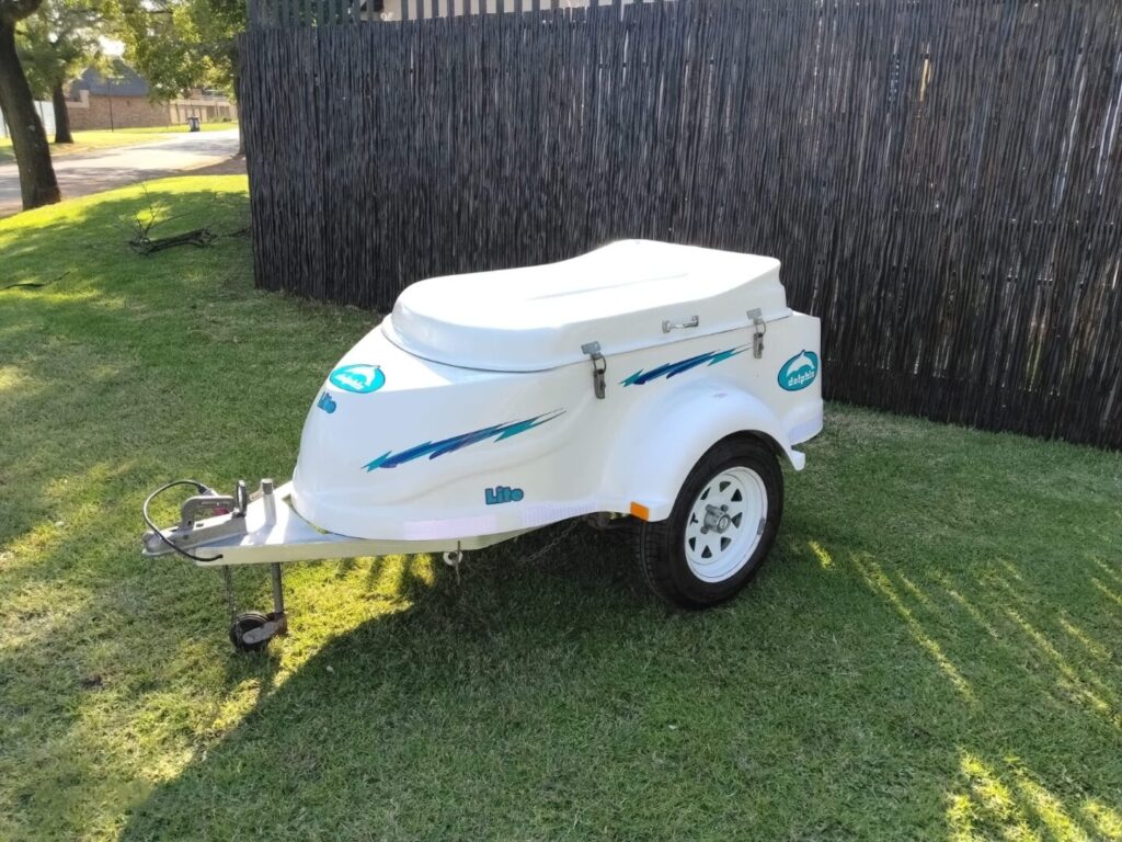 Side view of white Dolphin Lite trailer