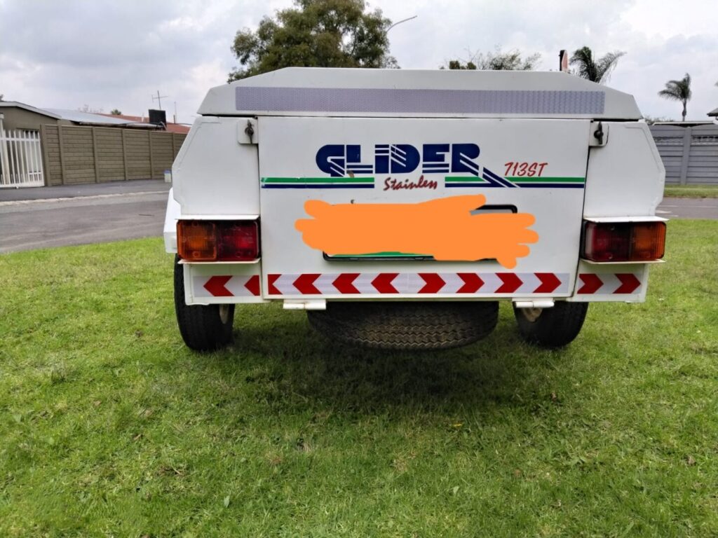 Rear view of Glider trailer with spare wheel visible underneath