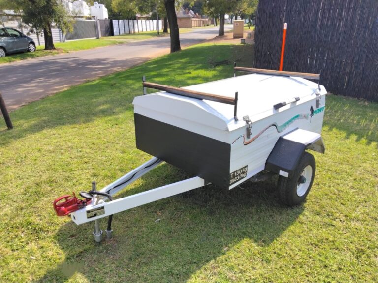 Front side view of white Pony luggage trailer