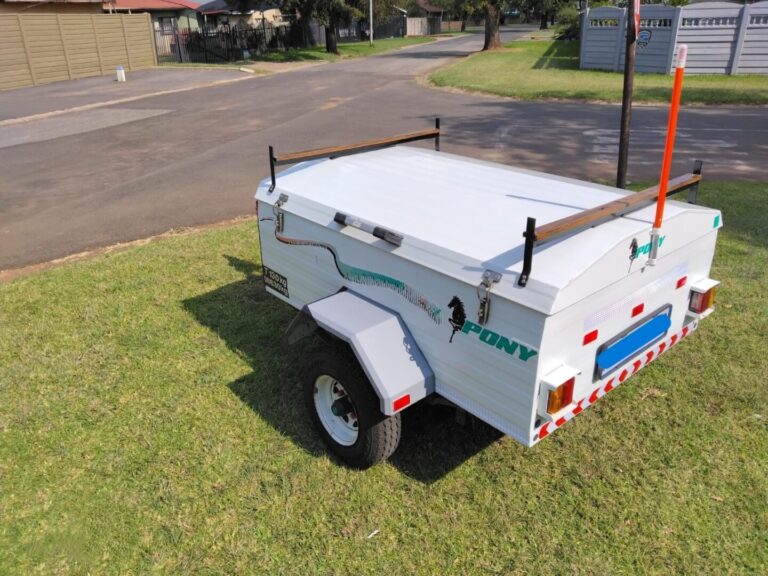 Rear side view of white Pony trailer