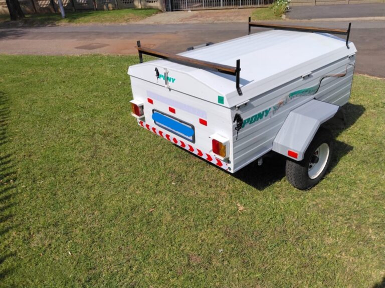 Rear angle view of Pony trailer on grass