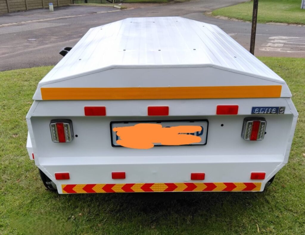 Rear view of refurbished Venter trailer with lights