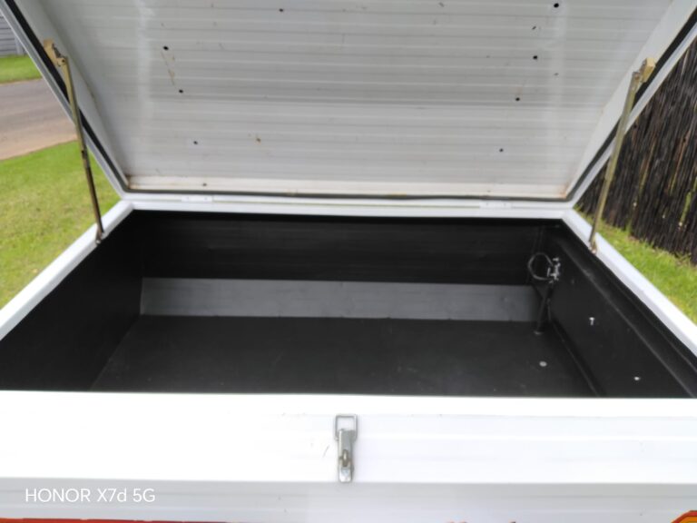 Open-lid interior view of Venter trailer storage area